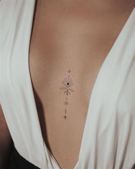 small tattoos between breast|20 in